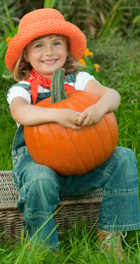girl and pumpkin for a natural Halloween